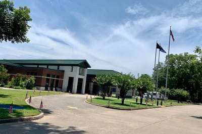 Exterior view of the veterans home with flags