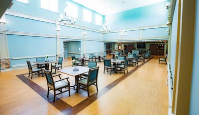 Bright common area with tables and chairs