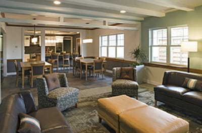 Bright common area with seating and dining space