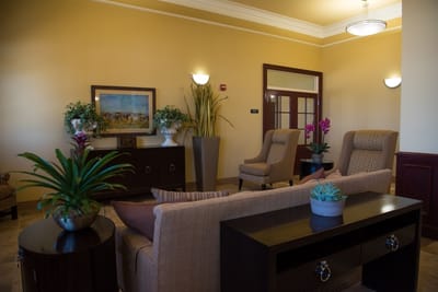 Interior lounge area with comfortable seating and plants
