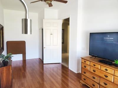 Interior view of a room with a TV and door