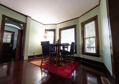A corner of a well-furnished living room with a table