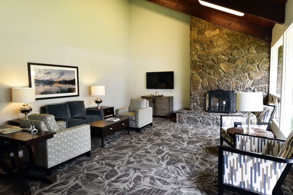 Cozy common area with comfortable seating and stone fireplace