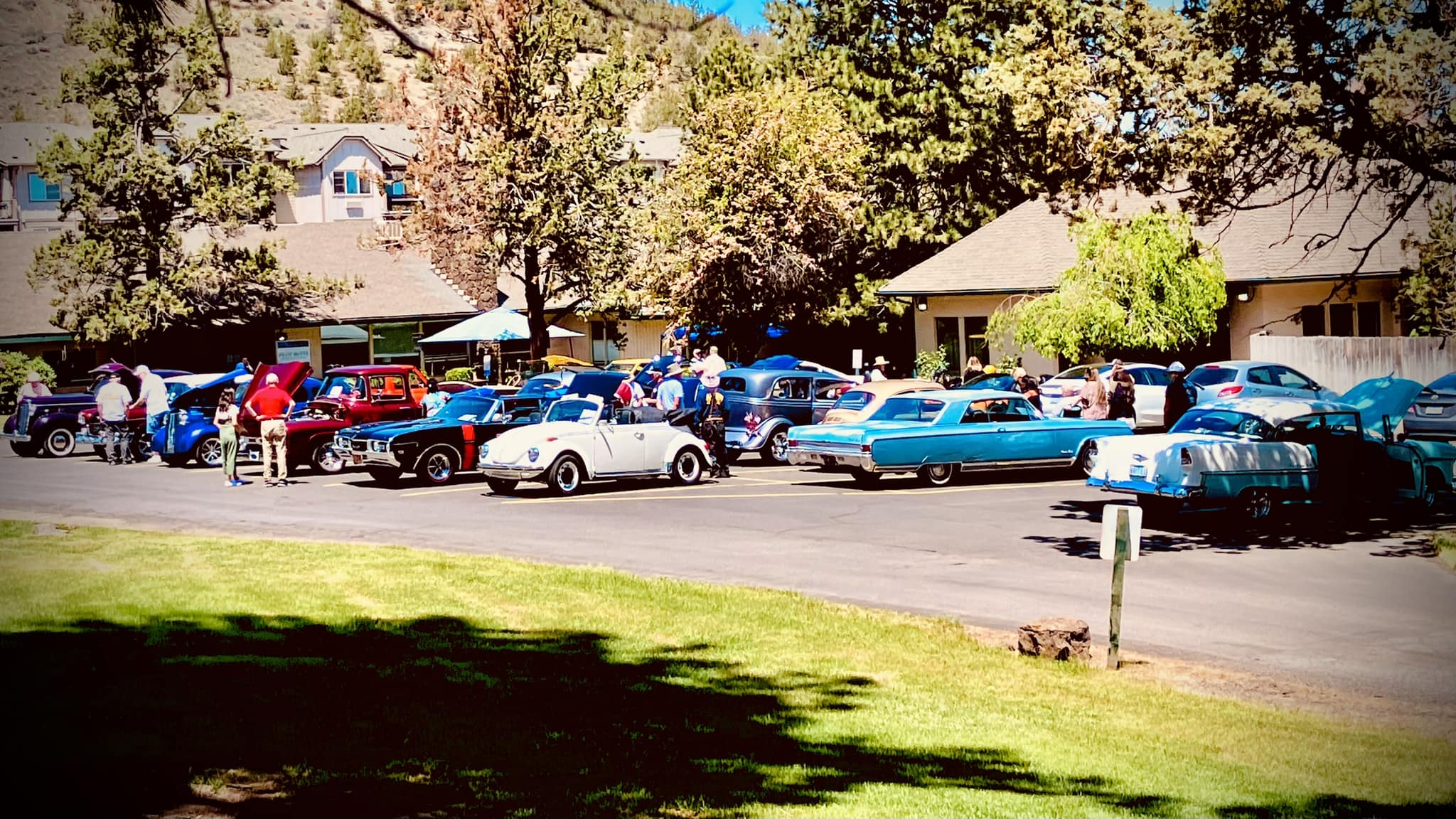 A classic car show in the facility parking area