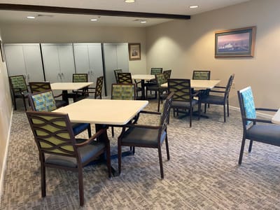 Bright common area with tables and chairs