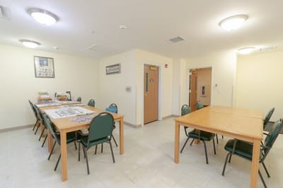 Interior view of a common area with tables and chairs