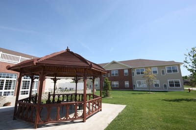 Outdoor gazebo with a building in the background