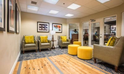 Bright common area with seating and artwork