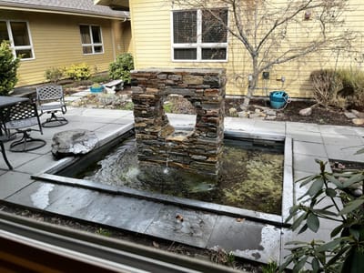A serene garden fountain in an outdoor space