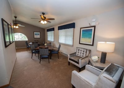 Bright common area with seating and tables