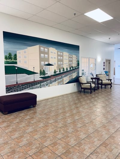 Common area featuring a mural of the facility