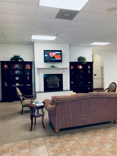 Interior common area with seating and a fireplace
