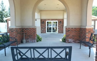 Entrance area of Riverwalk Village with benches