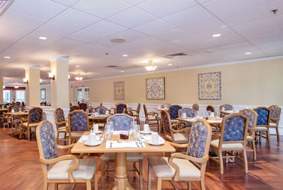Dining room set up for meals with elegant chairs