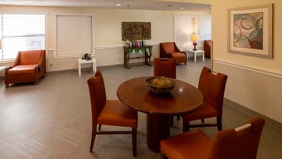 Common area with seating and tables in a bright room