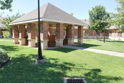 Outdoor gazebo in a green space at the facility