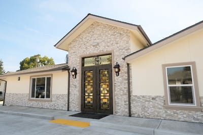 Entrance of a senior living facility with modern architecture
