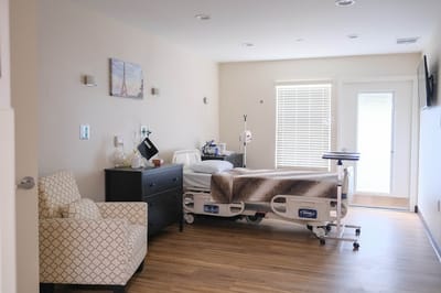 Comfortable resident room with a hospital bed