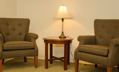 Cozy seating area with armchairs and a lamp