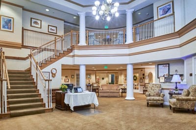 Bright and inviting common area with seating and stairs