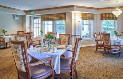 Dining room with tables set for a meal