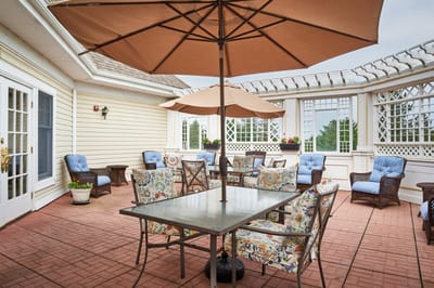 Outdoor patio area with seating and umbrellas