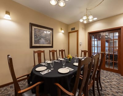 Dining room setup with a round table and elegant decor