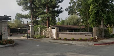 Entrance of Mt. San Antonio Gardens with gate and landscaping