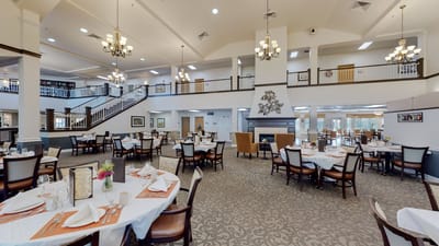 Elegant dining room setup with tables and chairs
