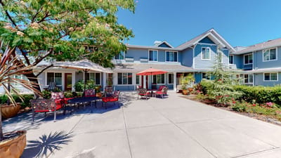Outdoor seating area with umbrellas and landscaping