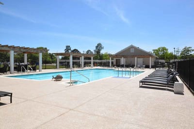Outdoor swimming pool area with seating