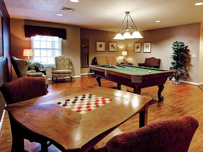 Interior game room with a pool table and checkers board
