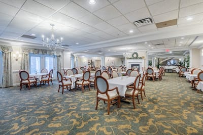Bright dining room with empty tables and chairs