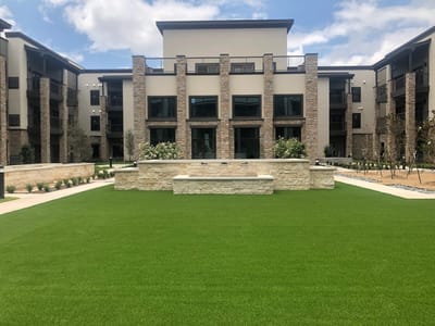 Exterior view of The Oscar at Georgetown with green lawn