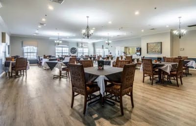 Interior view of a dining room with tables and chairs