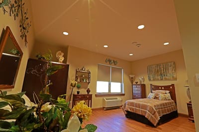 Bright, inviting private resident room with decor