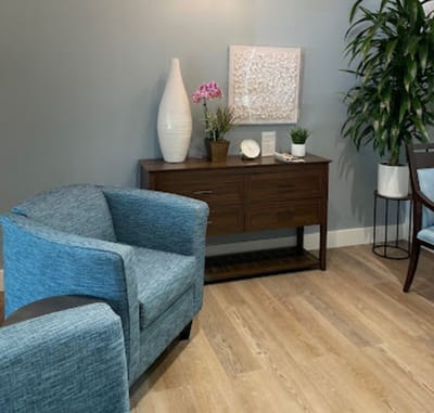 Interior lounge area with chairs and decorative plants