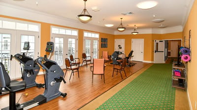 Interior exercise area with fitness equipment and seating
