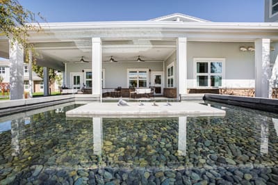 Outdoor patio area with seating and water feature