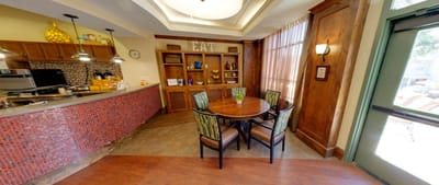 Bright dining area with a round table and chairs