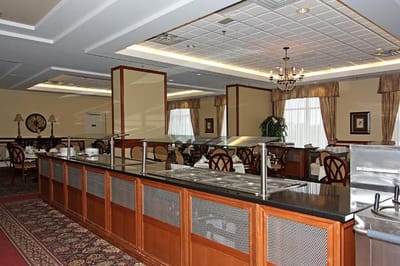 Dining area with a serving station and elegant decor