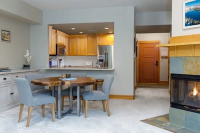 Cozy living area with dining table and fireplace