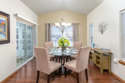 Bright dining area with a table set for a meal