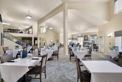 Dining room with tables set for residents