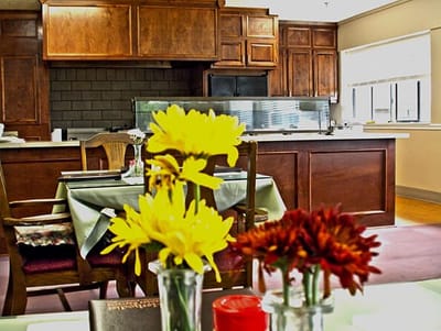 Brightly decorated dining area with flowers