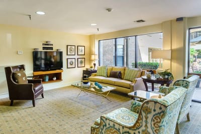 Bright common area with seating and TV