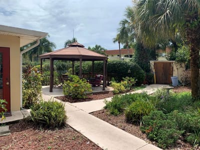Outdoor garden space with a gazebo and pathways