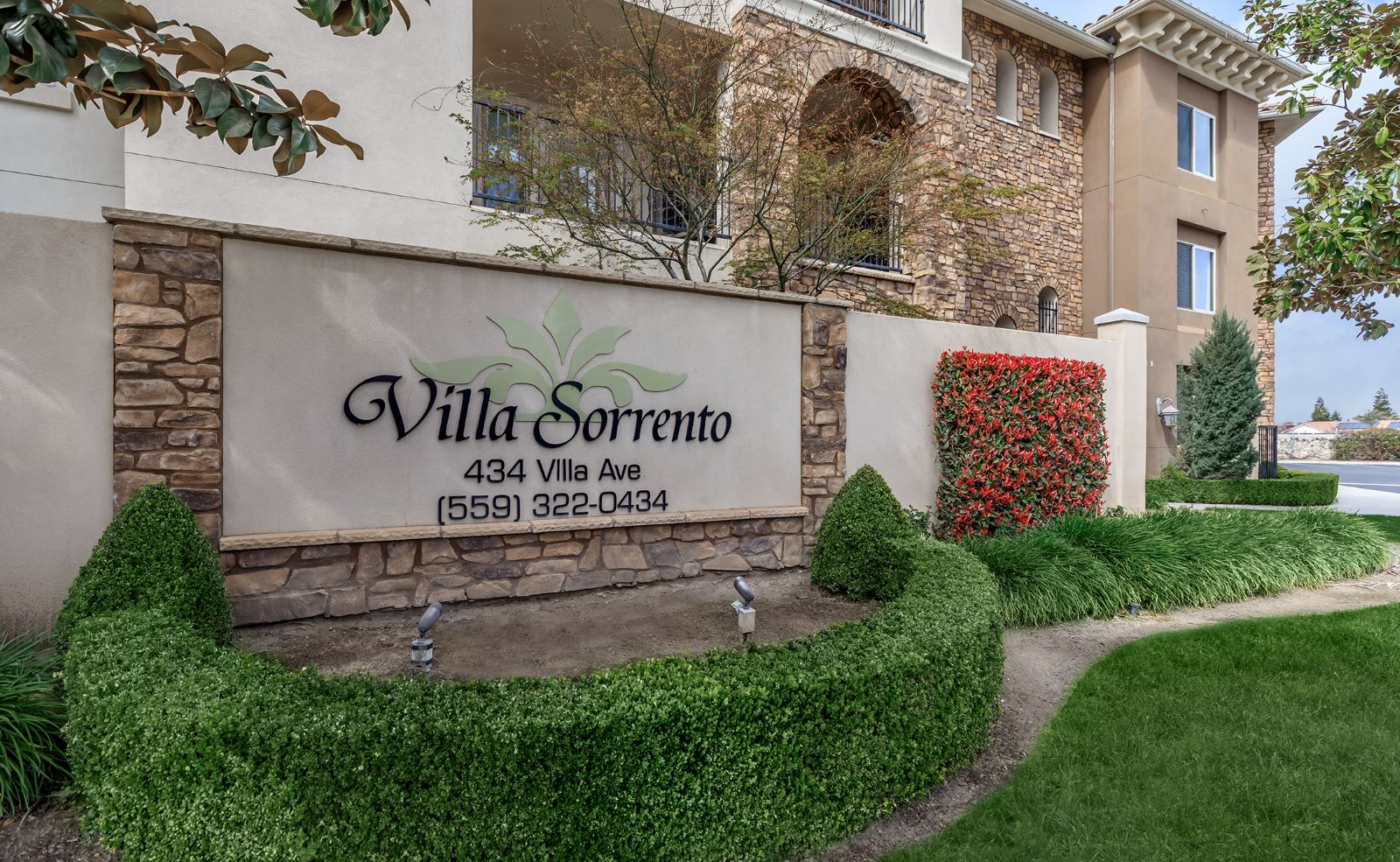 Exterior view of Villa Sorrento sign and landscape