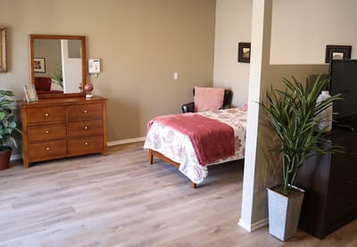 Cozy private resident room with furniture and decor