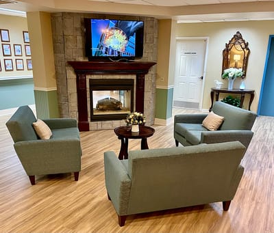 Cozy common area with seating and a fireplace